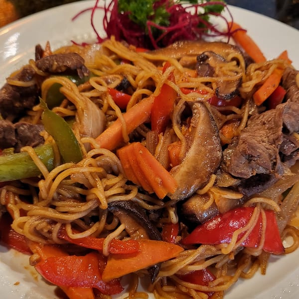 Nakama Sushi Thai's Pad See Ew with beef, noodles, mushrooms, carrots, and bell peppers.